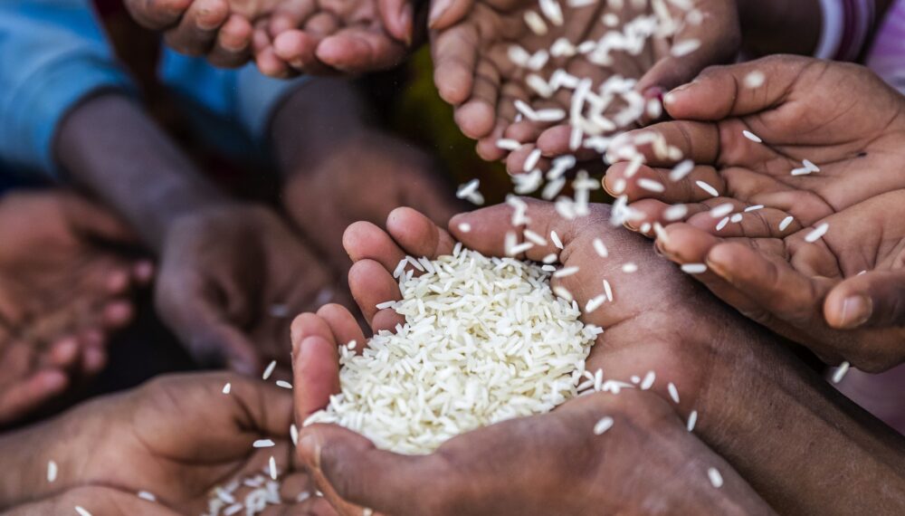 Poor African children keeping their hands up - asking for food. Many African children suffer from poverty - 20% of Africa’s children will die before the age of five.  Every day 30,000 children die from a combination of disease- infested water and malnutrition,